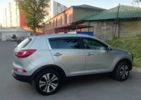 Kia Sportage 2014г. серого цвета вид справа сзади