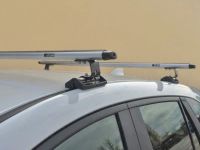 Универсальный багажник на крышу Peugeot Partner 2008-..., Евродеталь, вид Е, аэродинамические дуги